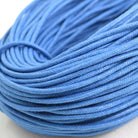 light blue coloured waxed round casual shoe laces, tied in individual bundles.