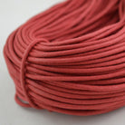 red coloured waxed round casual shoe laces, tied in individual bundles.