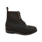 A Berwick 1707 dark brown, waxed roughout suede classic country toe cap derby boot with Dainite rubber sole and lace-up closure.