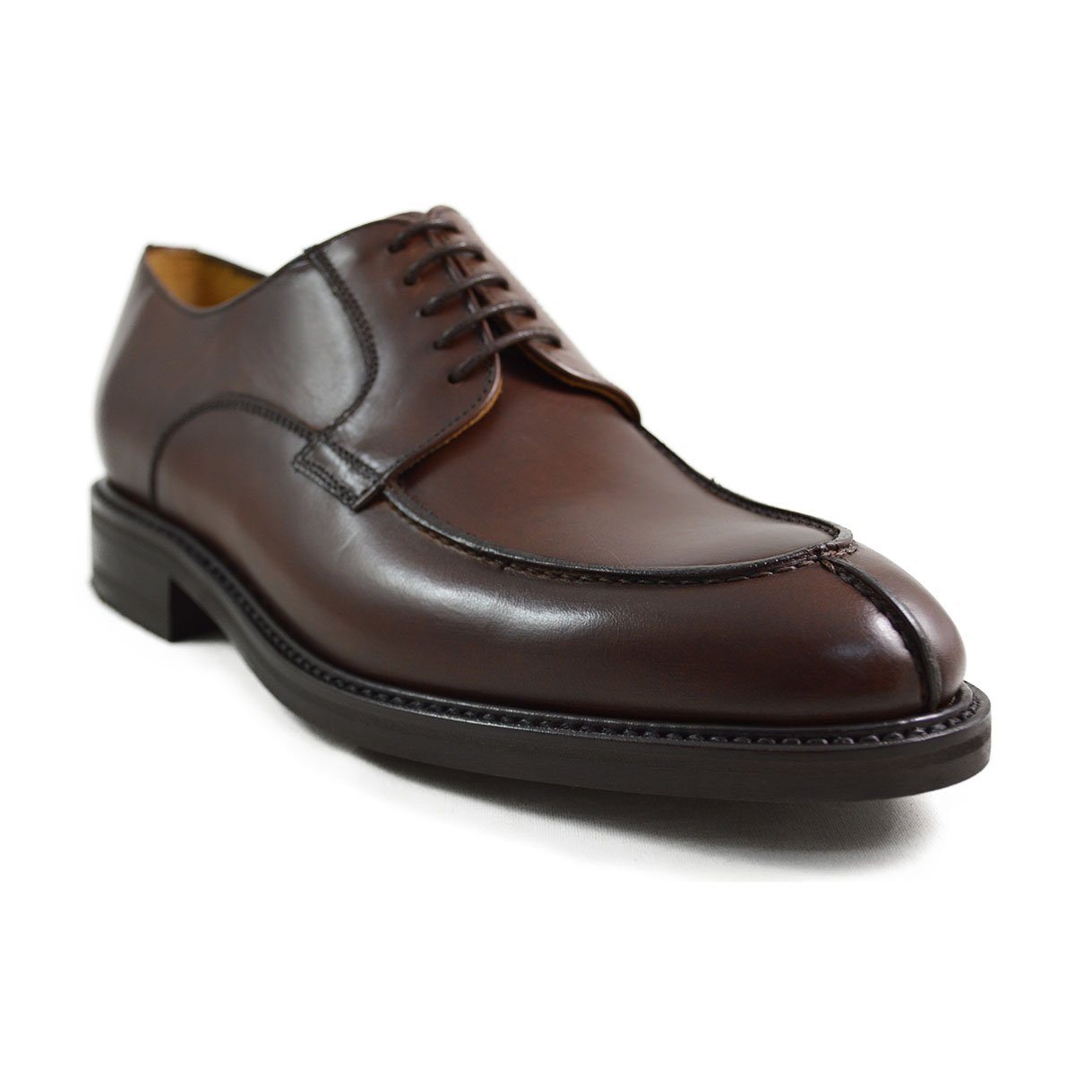 A pair of dark brown Berwick 1707 Split Toe Derby shoes with laces, set against a white background.