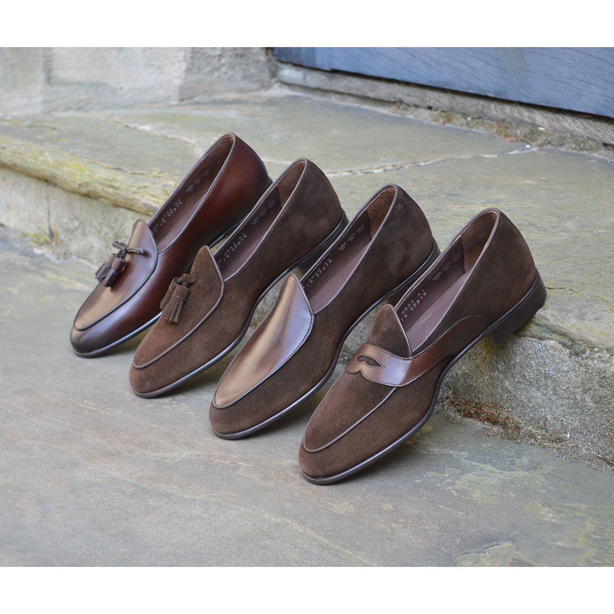 A Berwick 1 707 dark brown leather Belgian loafer with a braided leather bow tie and tassel adornment.
