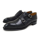 A Berwick 1707 lack double monk shoe with two buckle straps, made from calf leather and featuring a Goodyear welted leather sole.