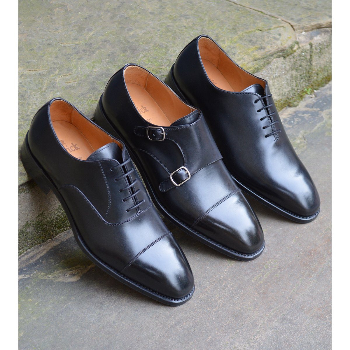 A black, boxcalf leather Oxford shoe with a chisel toe and lace-up closure, crafted in Spain.