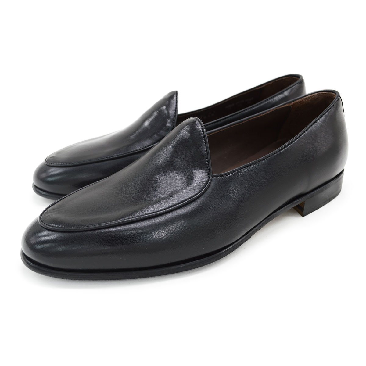 A classic black Berwick 1707 Belgian loafer with a smooth deerskin leather upper, an almond toe shape, and a low heel.