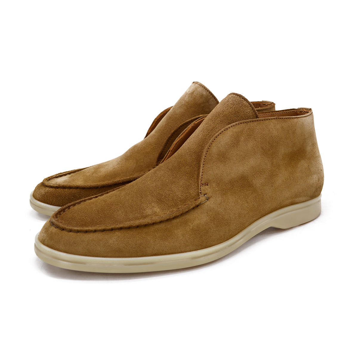 A brown ankle boot made of reverse kudu suede, featuring a low heel and a smooth texture.