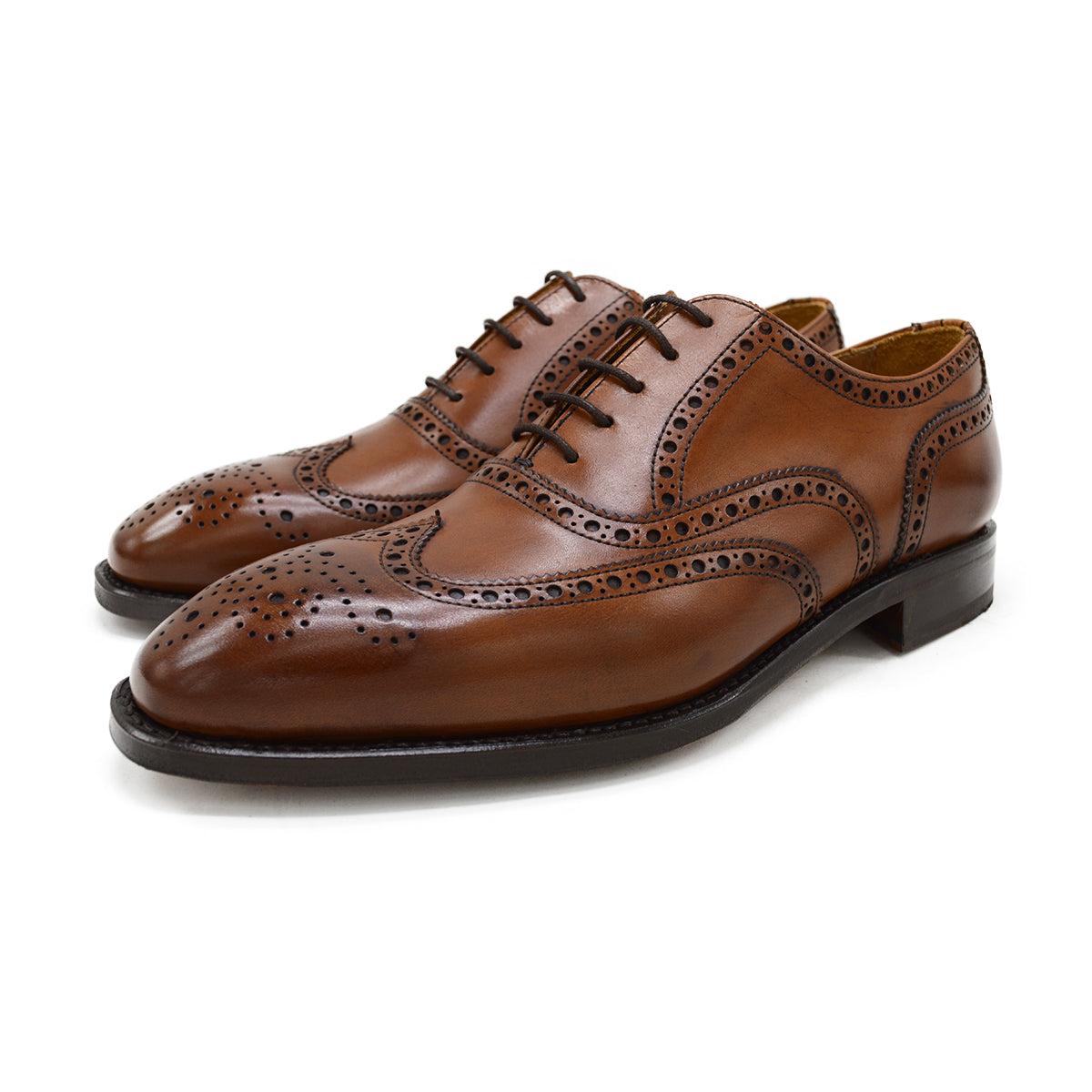A tan Berwick 1707 Oxford Brogue shoe with intricate brogue detailing and a goodyear welted leather sole.