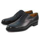 A Berwick 1707 black leather toe cap oxford shoe with a goodyear welted construction and single leather sole.