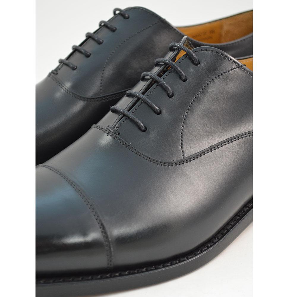 A Berwick 1707 black leather toe cap oxford shoe with a goodyear welted construction and single leather sole.