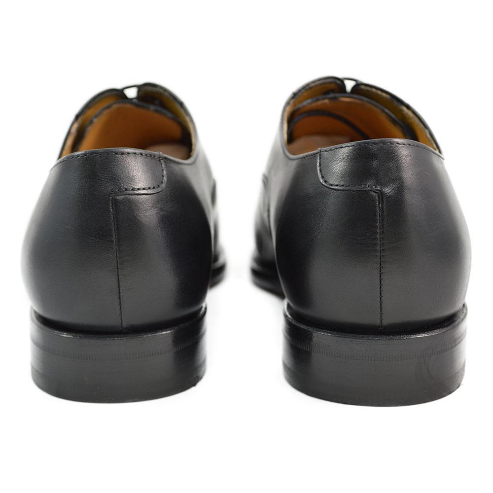 A Berwick 1707 black leather toe cap oxford shoe with a goodyear welted construction and single leather sole.