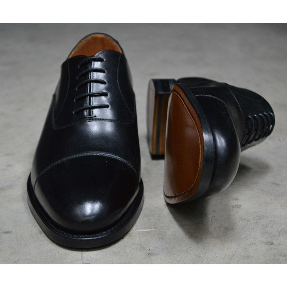 A Berwick 1707 black leather toe cap oxford shoe with a goodyear welted construction and single leather sole.