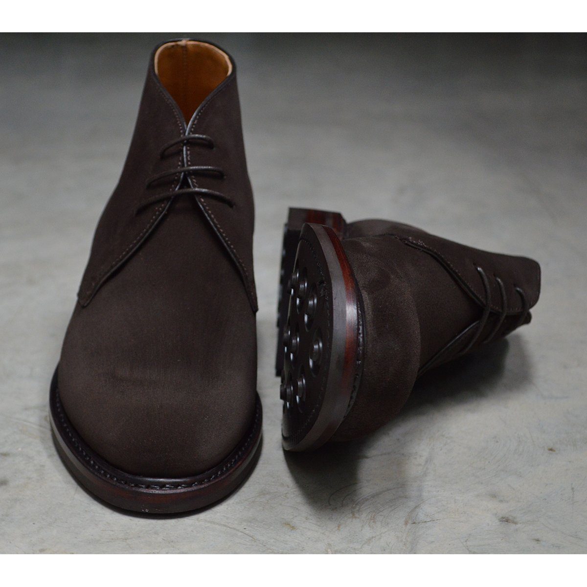 A Berwick 1707 dark brown suede Chukka boot with a round toe and low heel.