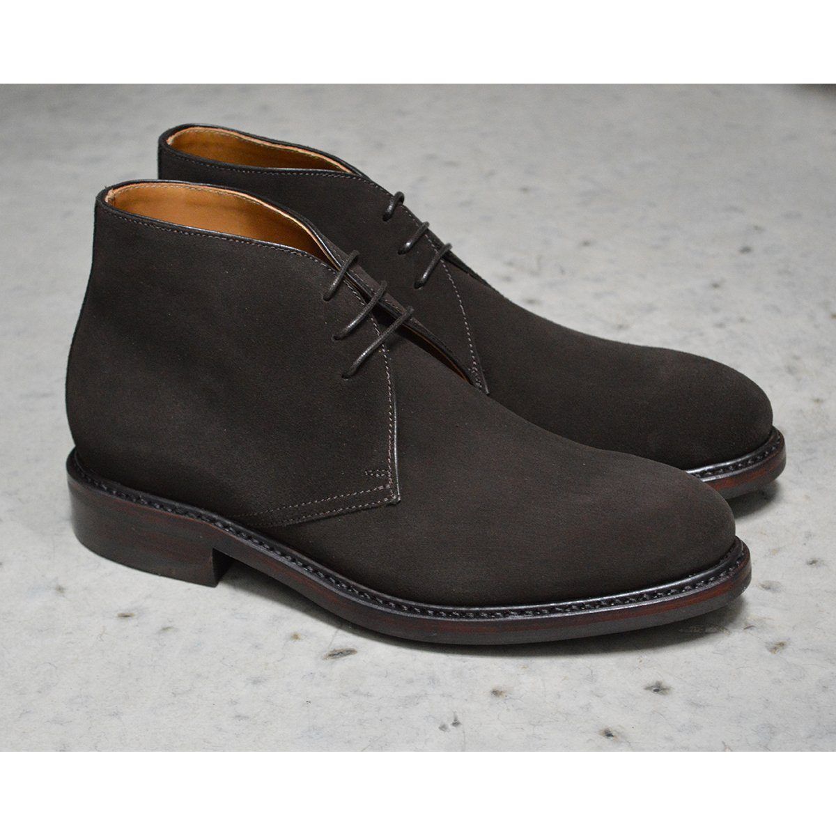 A Berwick 1707 dark brown suede Chukka boot with a round toe and low heel.