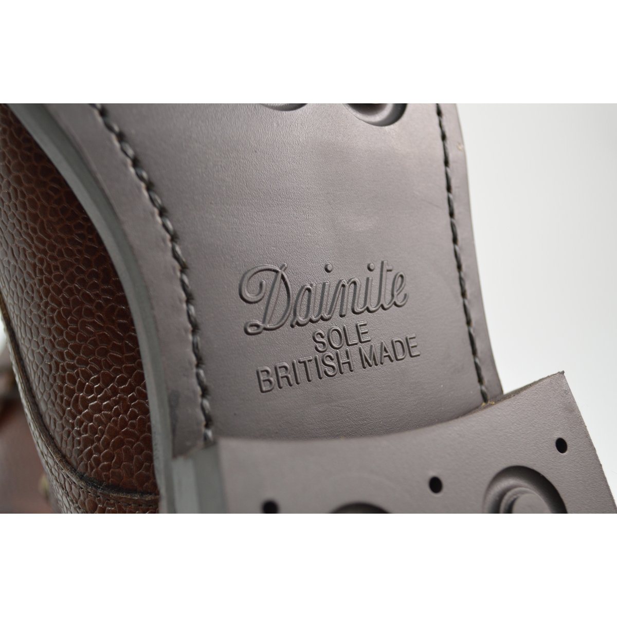 A Berwick 1707 dark brown, premium grain leather lace-up boot with a cap toe and a low heel & Dainite Sole
