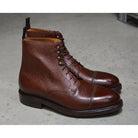 A Berwick 1707 dark brown, premium grain leather lace-up boot with a cap toe and a low heel & Dainite Sole