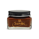 A glass jar with a black lid containing Saphir Medaille D'Or oiled leather cream, branded with the Saphir logo in gold lettering on a black label.
