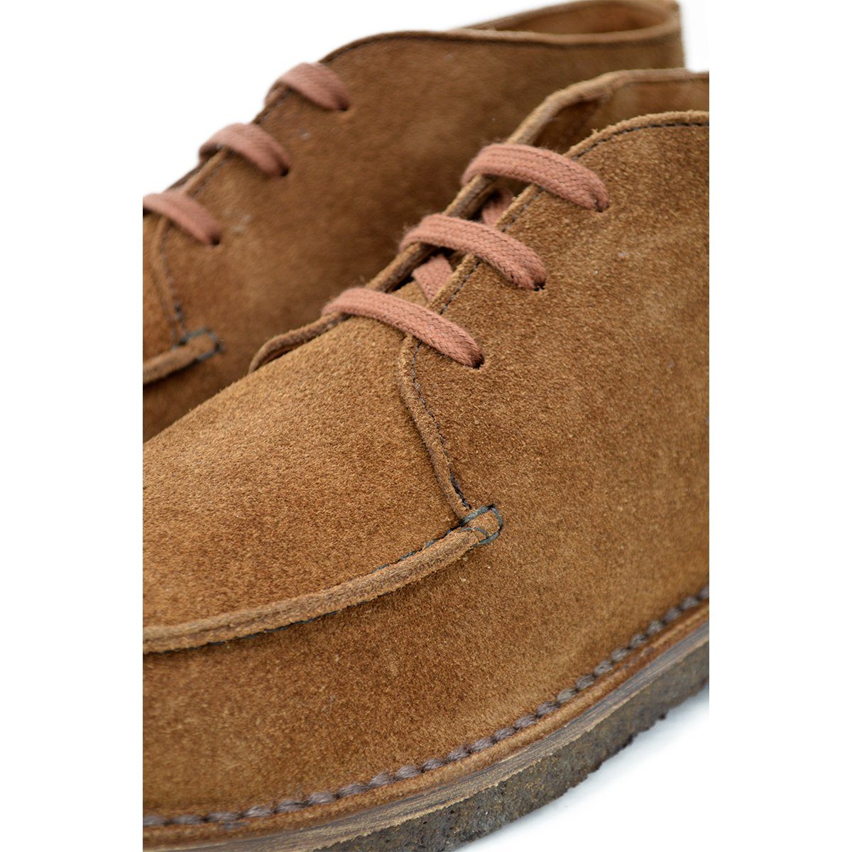 A brown Berwick 1707 5432 Apron Boot with lace-up closure, handcrafted from reverse kudu suede, featuring moccasin stitching and a crepe rubber sole.