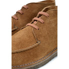 A brown Berwick 1707 5432 Apron Boot with lace-up closure, handcrafted from reverse kudu suede, featuring moccasin stitching and a crepe rubber sole.