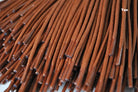 A close-up of a brown waxed round cotton shoe lace.