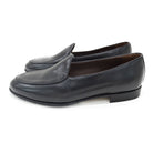 A classic black Berwick 1707 Belgian loafer with a smooth deerskin leather upper, an almond toe shape, and a low heel.