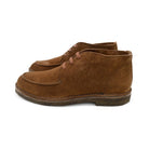 A brown Berwick 1707 5432 Apron Boot with lace-up closure, handcrafted from reverse kudu suede, featuring moccasin stitching and a crepe rubber sole.