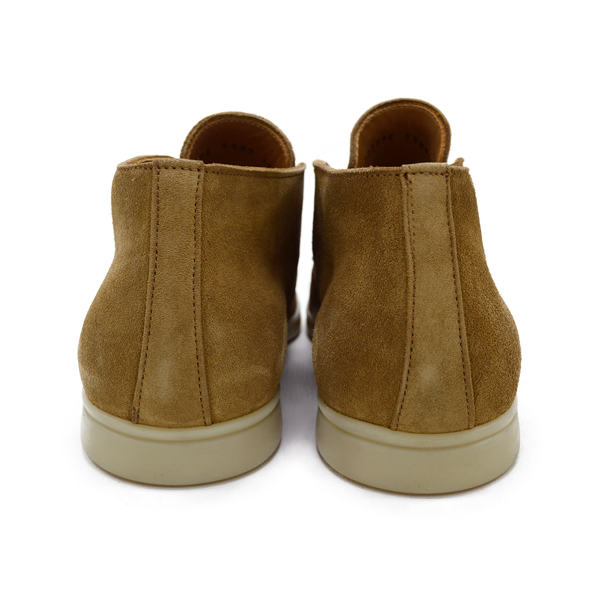 A brown ankle boot made of reverse kudu suede, featuring a low heel and a smooth texture.