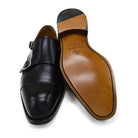 A Berwick 1707 lack double monk shoe with two buckle straps, made from calf leather and featuring a Goodyear welted leather sole.