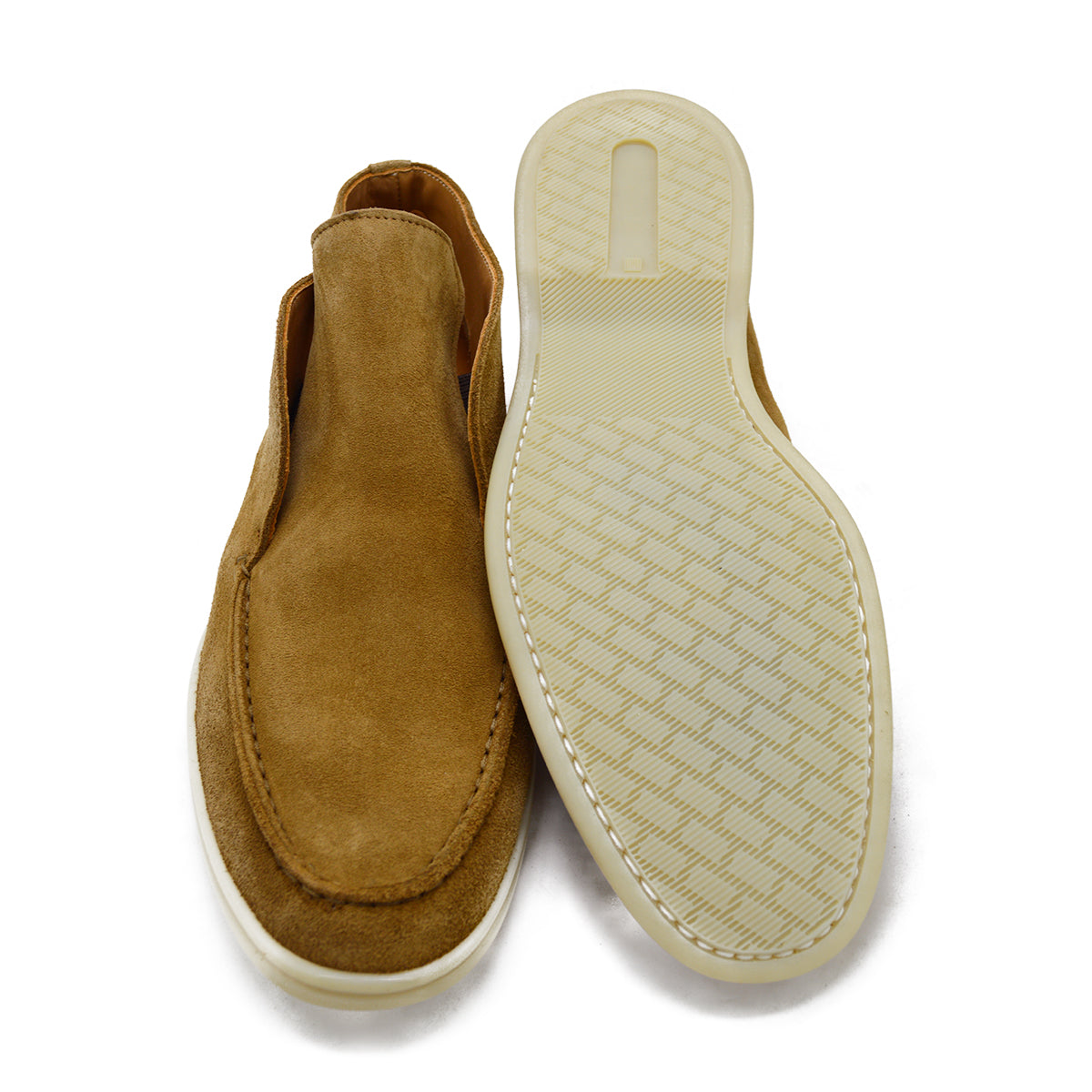 A brown ankle boot made of reverse kudu suede, featuring a low heel and a smooth texture.