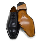 A Berwick 1707 black leather Oxford shoe with a wholecut design and lace-up closure