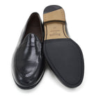 A classic black Berwick 1707 Belgian loafer with a smooth deerskin leather upper, an almond toe shape, and a low heel.