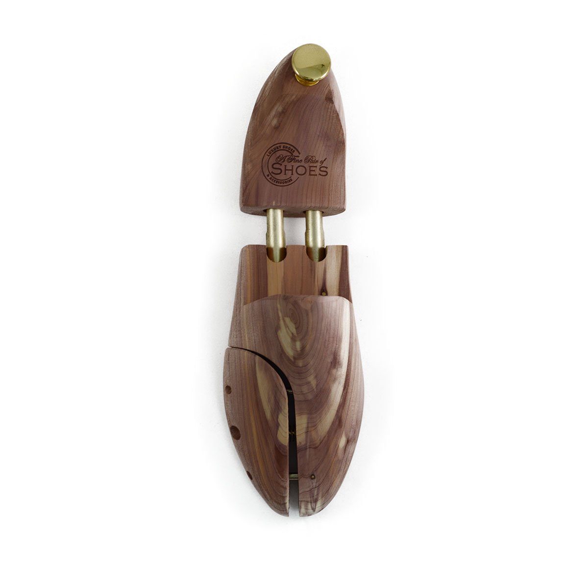 A pair of uncompressed cedar wood shoe trees with brass fitments, displayed in an open position.