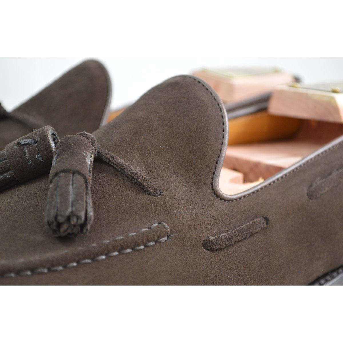 A classic dark brown suede slip-on shoe with tassels, by Berwick 1707.