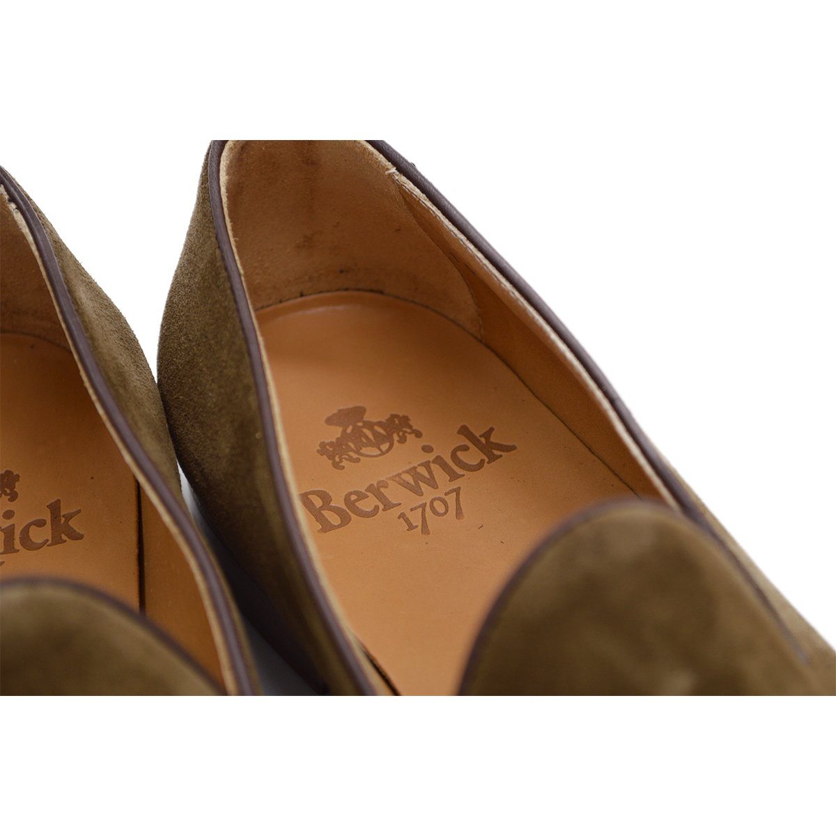 A brown suede tassel Berwick 1707 Belgian loafer with a combination leather and fine rubber sole.