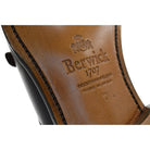 A black, boxcalf leather Oxford shoe with a chisel toe and lace-up closure, crafted in Spain.