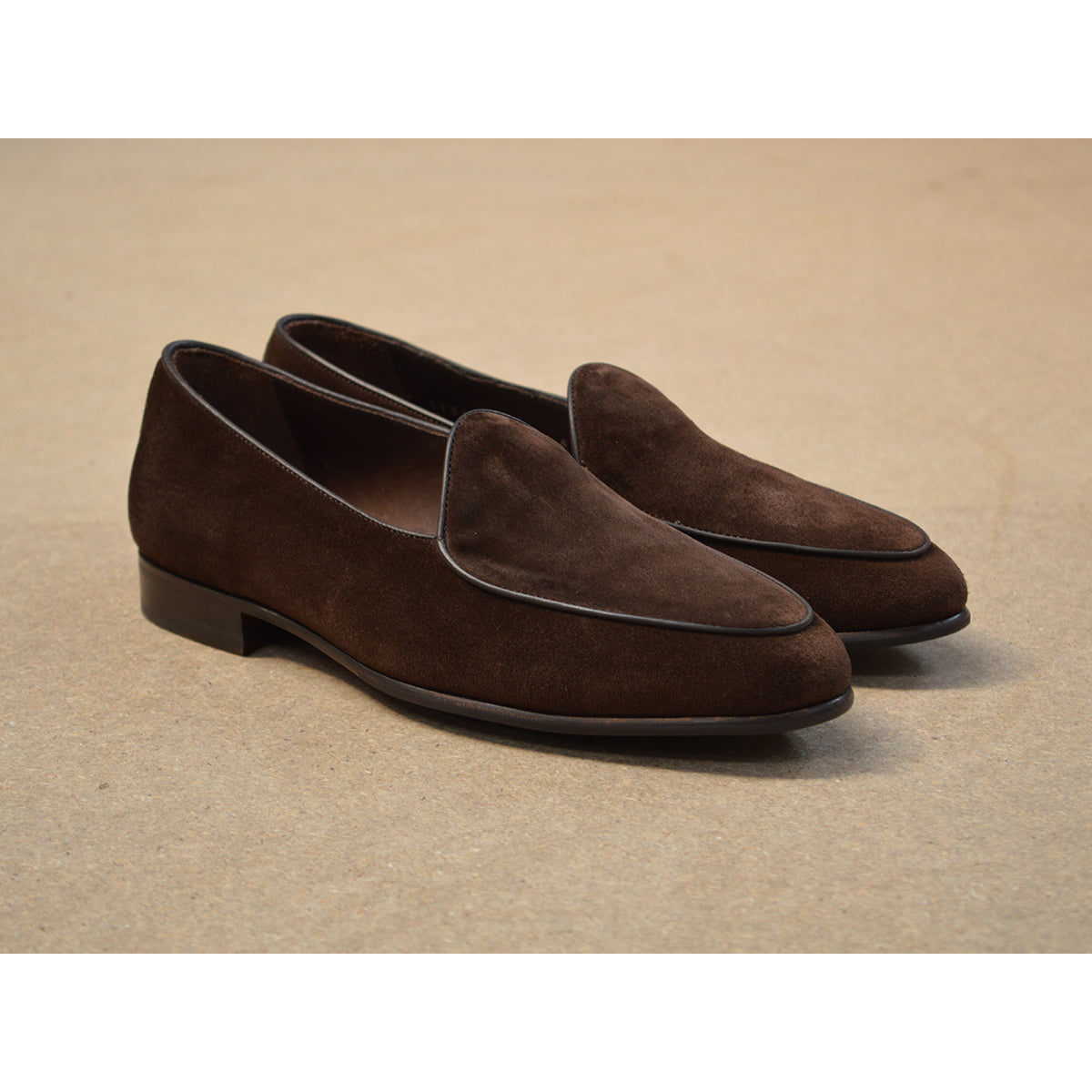 Brown Berwick 1707 Belgian suede loafer shoe on a brown background