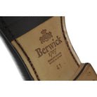 A classic black Berwick 1707 Belgian loafer with a smooth deerskin leather upper, an almond toe shape, and a low heel.