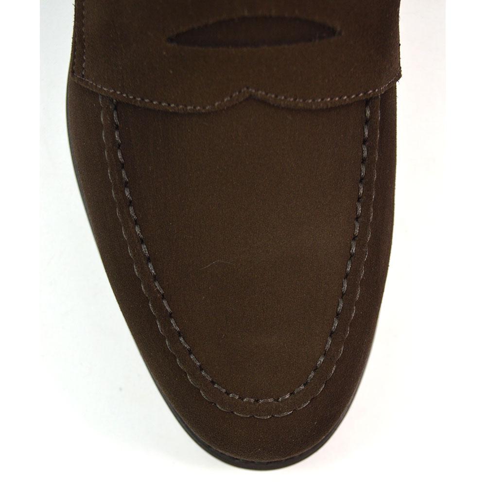 A dark brown suede penny loafer with a Goodyear welted leather sole, displayed on a white background.