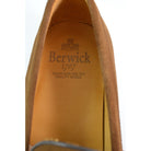 A brown suede penny loafer with a Dainite rubber sole, showing a classic round toe shape and a signature penny slot detail & Dainite Soles