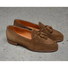 A brown suede tassel Berwick 1707 Belgian loafer with a combination leather and fine rubber sole.