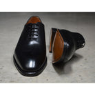 A Berwick 1707 black leather Oxford shoe with a wholecut design and lace-up closure