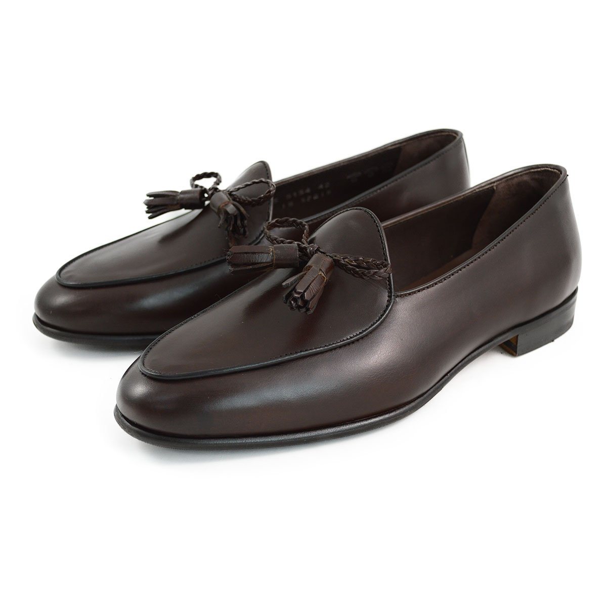A Berwick 1 707 dark brown leather Belgian loafer with a braided leather bow tie and tassel adornment.