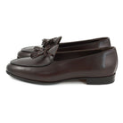 A Berwick 1 707 dark brown leather Belgian loafer with a braided leather bow tie and tassel adornment.