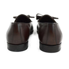 A Berwick 1 707 dark brown leather Belgian loafer with a braided leather bow tie and tassel adornment.