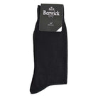 A pair of black plain knit socks with the Berwick 1707 brand tag visible.