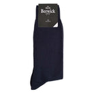 A pair of navy plain knit socks with the Berwick 1707 brand tag visible.