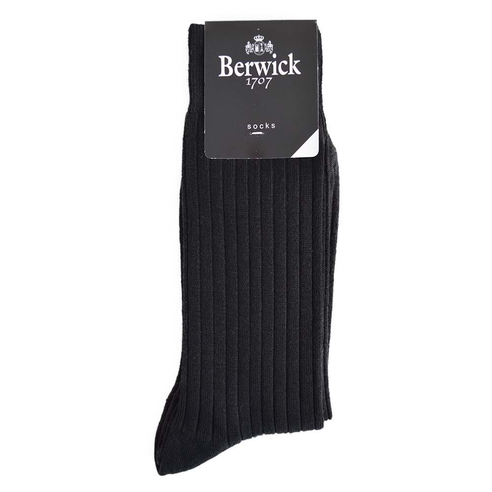 A pair of black ribbed socks with the Berwick 1707 brand tag visible.