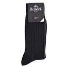 A pair of black ribbed socks with the Berwick 1707 brand tag visible.
