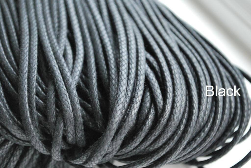 A close-up image of a waxed round brown shoe lace.