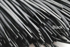 A close-up image of a waxed round brown shoe lace.