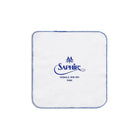 White cloth with Saphir logo on a white background