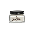 A glass jar with a black lid labeled 'SAPHIR' containing Renovator cream for leather care.